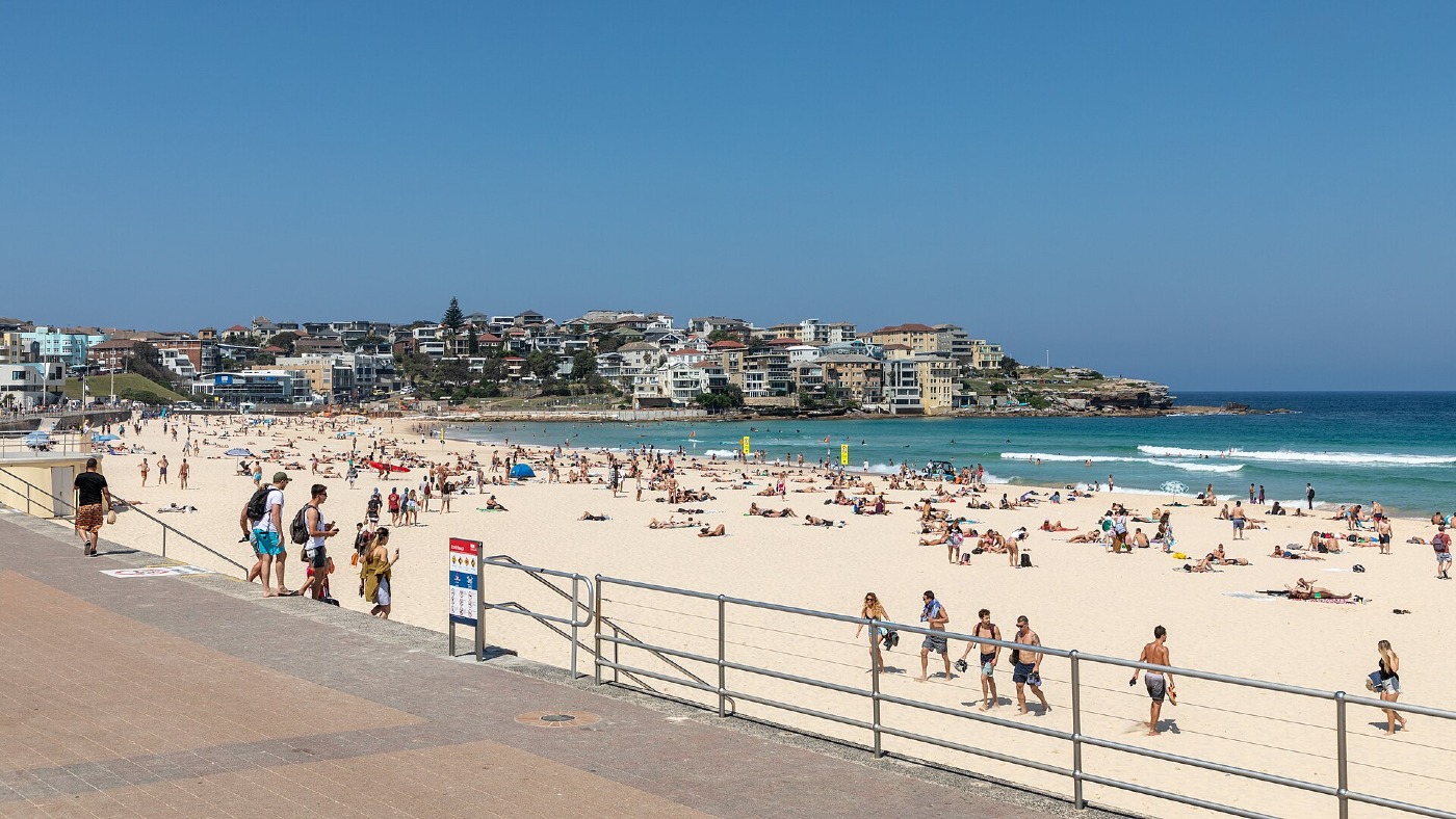 Bondi Beach in Sydney on a sunny day, busy with swimmers and sunbathers